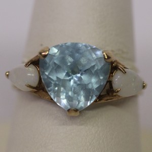 Womans Light Blue stone and opal ring Size 8. 