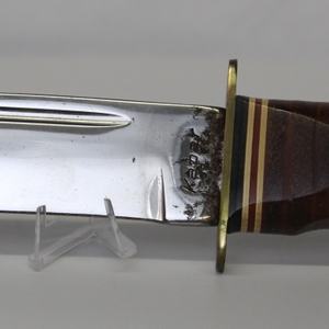 K-Bar 1208 knife, versatile use, includes protective sheath.