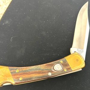 BUCK  110 AUTO OPENING