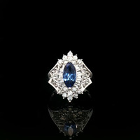 10KT White Gold Ring with Synthetic Blue Stone and CZ's - Size 7