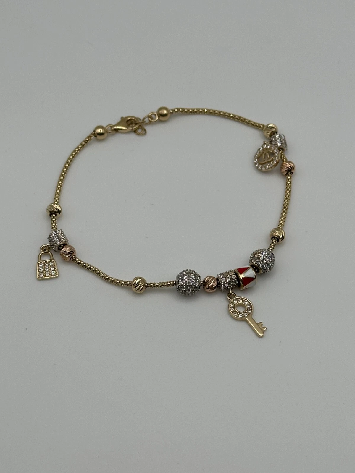14KT Yellow Gold Charms Bracelet with CZs 8in 7.3g