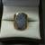14K YELLOW GOLD HAMMERED LOOK RING WITH OVAL CUT FIRE OPAL 