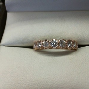 14K ROSE GOLD BAND WITH 9 .10CT EA DIAMONDS