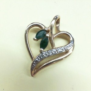  HEART AND MARQUISE CUT EMERALDS EA .10CT