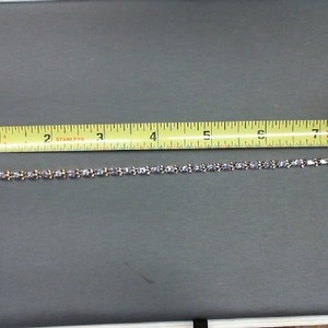 . .14K YELLOW GOLD TENNIS BRACELET WITH OVAL IOLITE