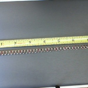 . .10K YELLOW GOLD TENNIS BRACELET WITH SAPPHIRE, RUBY, EMERALD STONES
