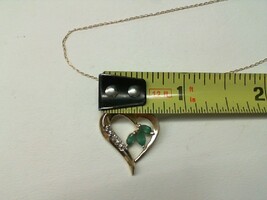 . .10K YELLOW GOLD NECKLACE WITH HEART PENDANT SET WITH 3 EMERALDS 1 DIAMOND