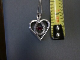 Necklace SILVER HEART WITH FLOATING RED STONE ON FINE SILVER CHAIN