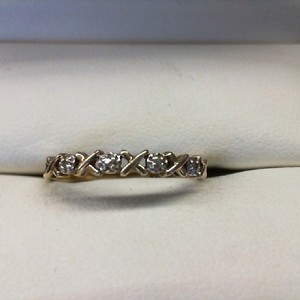 X'S AND O'S  THIN BAND WITH 4 .01CT DIAMONDS RING