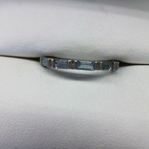  TINY BAND W/ IOLITE BAGUETTES SET AROUND THE BAND