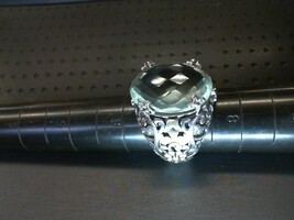  STERLING SILVER SWIRL PATTERN RING WITH LARGE OVAL CUSION CUT LIGHT GREEN