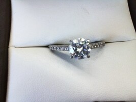  1.50 carat lab grown diamond with 22ea .01 accent diamonds set in platinum