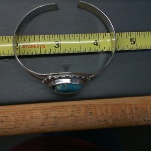 . .STERLING SILVER CUFF STYLE BRACELET WITH ROUND TURQUOISE
