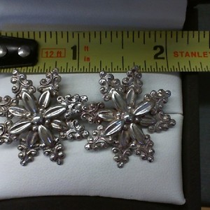 . .STERLING SILVER SNOW FLAKE CLIP ON EARRINGS