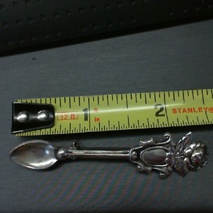. .STERLING SILVER PIN SHAPED LIKE A SPOON