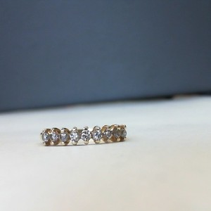  Yellow Gold 14kt Band 2.20gms Ring GOLD BAND WITH ROW OF PRONG SET DIAMONDS