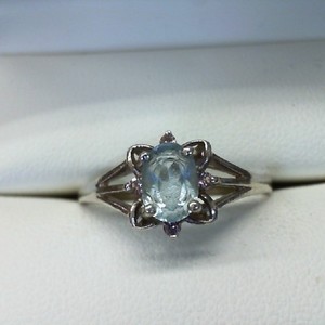  STERLING SILVER RING WITH OVAL AQUA MARINE AND 4EA .01CT PINK STONE