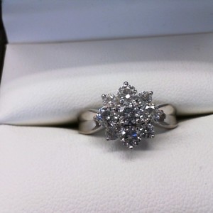  STERLING SILVER RING WITH CZ'S SET IN FLOWER SETTING