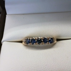  14K YELLOW GOLD BAND WITH 5 SAPHIRES .10CT EACH