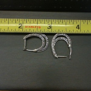  DOUBLE HOOP EARRINGS WITH MULTIPLE DIAMONDS SET AROUND BOTH HOOPS