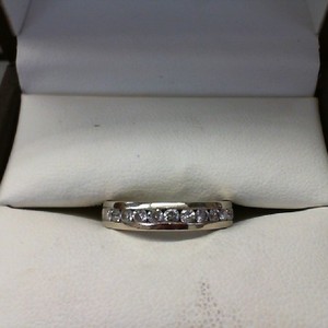  14K WHITE GOLD BAND WITH 12 DIAMONDS .04CT EACH TOTAL DIA WT .48CT- WITH PAPERW