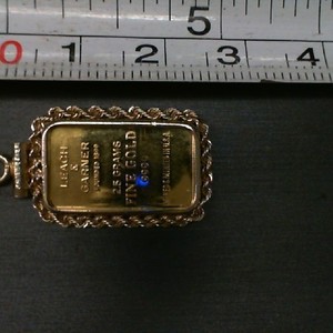 2.5GMS .999 GOLD INGOT SURROUNDED BY 14K ROPE SETTING