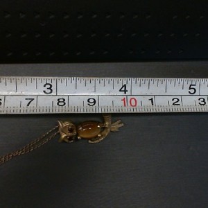  14K YELLOW GOLD OWL PENDANT WITH GARNET EYES AND TIGER EYE CENTER WITH A 14K FI