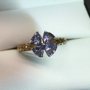 . .4 TRILLION CUT TANZANITE SET IN FLOWER STYLE RING
