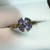 . .4 TRILLION CUT TANZANITE SET IN FLOWER STYLE RING