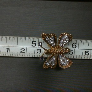  18K YELLOW GOLD BUTTERFLY PIN WITH DIAMOND WINGS WITH 2 SAPPHIRES