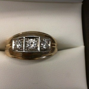  14K YELLOW GOLD BAND WITH .33CT CENTER DIAMOND WITH .25CT DIAMOND EACH SIDE -24