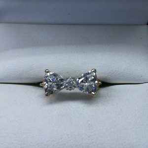  10K YELLOW GOLD RING 2 CZ'S IN BOW STYLE SETTING 