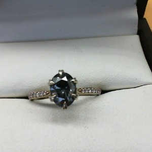  MOISSANITE WITH BLACK BACKING SET IN 14K YELLOW GOLD WITH DIAMOND ACCENTS ON BA