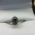  MOISSANITE WITH BLACK BACKING SET IN 14K YELLOW GOLD WITH DIAMOND ACCENTS ON BA