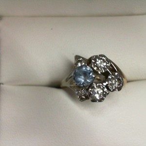  14K WHITE GOLD AND DIAMOND RING WITH SAPPHIRE(? ROUGH) .50CT CENTER STONE AND 5