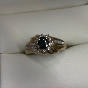 10K YELLOW GOLD WITH OVAL SAPPHIRE AND DIAMOND ACCENTS 