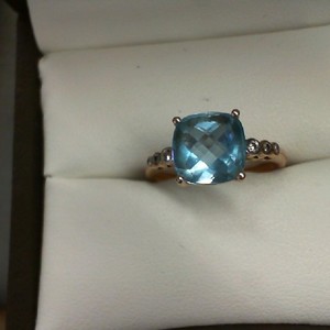  10k ROSE GOLD WITH CUSHION CUT AQUA MARINE AND 6 ACCENT DIAMONDS