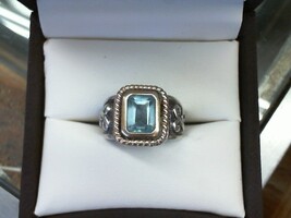  EMERALD CUT BLUE TOPAZ IN 14K YELLOW GOLD SETTING IN A STERLING SILVER RING