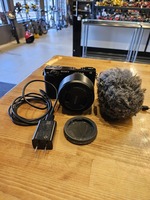 Sony APS-C Camera w/ 50mm Lens, Charger, & Mic