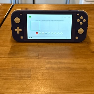 PURPLE NINTENDO SWITCH LITE IN CARRYING CASE WITH CHARGER