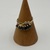 4.4g / 10k YELLOW GOLD RING W/ 6 BLACK GEMS AND 2 SMALL DIAMONDS
