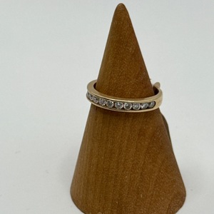 2.50gms 14K YELLOW GOLD RING WITH CHANNEL SET OF .03 DIAMONDS 
