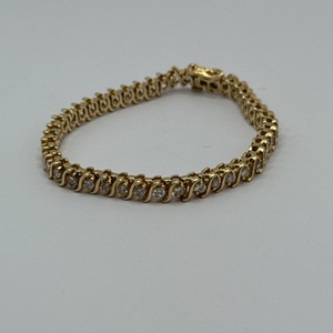 14KT YELLOW GOLD BRACELET W/ DIA CHIPS ALONG BRACELET 18.8G 