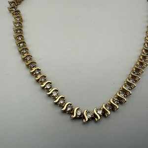 14K YELLOW GOLD TENNIS BRACELET WITH ROW OF .05 DIAMONDS 