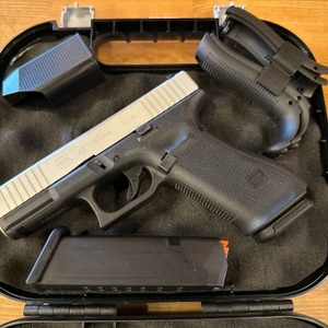 GLOCK 45 SILVER SLIDE AND TWO MAGS AND A HARD CASE AND CHANGEABLE GRIPS
