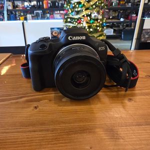 Canon EOS R100 24.1 MP Mirrorless Digital Camera with battery charger 