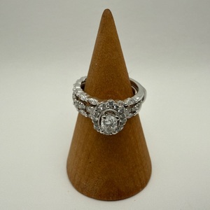 14K W/G SET W/ .40 CENTER DIAMOND SURROUNDED BY .03 SECONDARY BAND HAS LAB GROWN