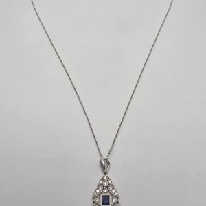 14K WHITE GOLD WITH BLUE STONE IN CENTER 18"