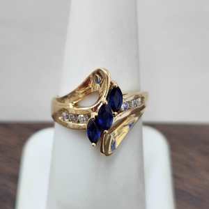 Swirl Design Ring with blue Stones & Diamonds