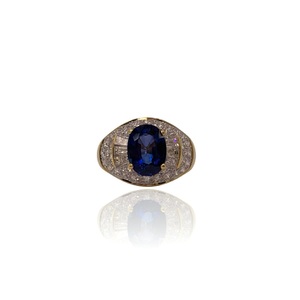  JAGI 18K Ladies Ring – Oval Blue Sapphire with Round and Baguette Diamonds 